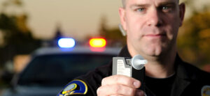 A Police Officer Administering a Breathalyzer