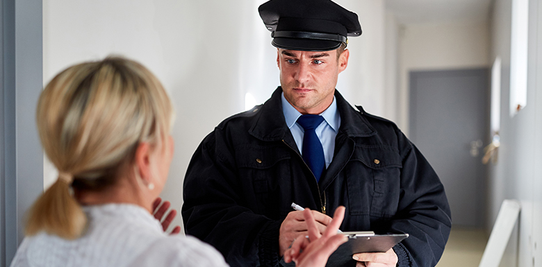 Woman talking to police officer image